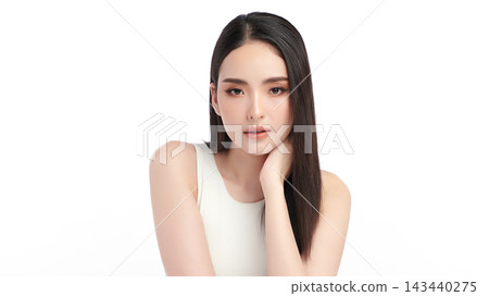 A beautiful young Asian woman with clean, fresh skin against a white background. Skincare, facial treatment, cosmetology, beauty, and spa. An elegant portrait of an Asian woman. A beautiful young Asian woman with clean, fresh skin against a white background. Skincare, facial treatment, cosmetology, beauty, and spa. An elegant portrait of an Asian woman. 143440275
