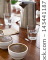 coffee cups prepared for the Q grader professional cupping session to evaluate aroma and flavor. Specialty coffee tasting setup in a cafe or roastery. 143441187