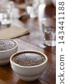 coffee cups prepared for the Q grader professional cupping session to evaluate aroma and flavor. Specialty coffee tasting setup in a cafe or roastery. 143441188