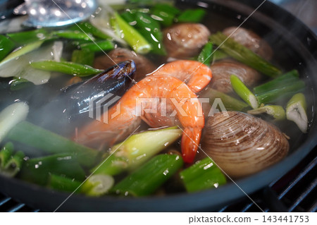 Korean Seafood Noodle Soup Kalguksu with Clams and Shrimp Korean Seafood Noodle Soup Kalguksu with Clams and Shrimp 143441753