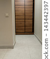 Modern wooden sliding door wardrobe in apartment hallway. 143442397