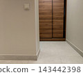 Minimalist hallway interior with built-in wooden closet. 143442398