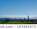 Taipei 101 skyline above riverside park and elevated expressway under blue sky 143442673