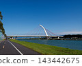 White arch Dazhi Bridge with red cables over the Keelung River on a sunny day 143442675