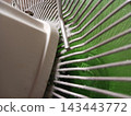 Dust and dirt accumulated on a fan used for everyday purposes 143443772