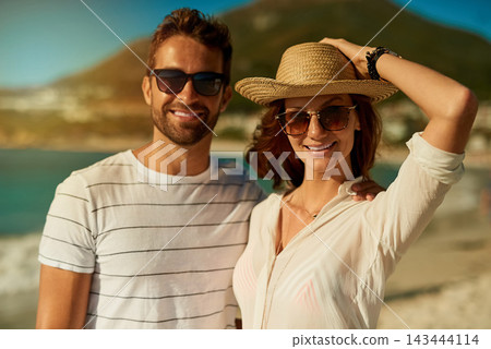 Love, portrait and relax with couple on beach together for anniversary, date or romance in summer. Holiday, travel or vacation with smile of man and woman on tropical island paradise for honeymoon Love, portrait and relax with couple on beach together for anniversary, date or romance in summer. Holiday, travel or vacation with smile of man and woman on tropical island paradise for honeymoon 143444114