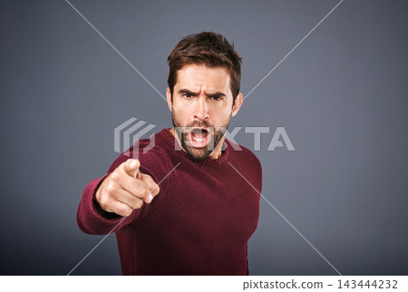 Blame, shouting and portrait of man, pointing and angry with you, choice or decision in studio. Black background, yelling and hand of person, gesture and serious of opinion and poster in England 143444232