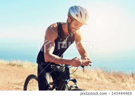 Man, outdoor and smartphone with bicycle for fitness or workout, health and wellness with communication. Person, online and bike for training on mountain for cycling tour, adventure and trail riding. Man, outdoor and smartphone with bicycle for fitness or workout, health and wellness with communication. Person, online and bike for training on mountain for cycling tour, adventure and trail riding. 143444469
