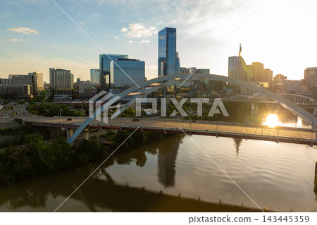 Highway traffic with driving cars on Korean Veterans Memorial Bridge in downtown district of Nashville city in Tennessee, USA. Highway traffic with driving cars on Korean Veterans Memorial Bridge in downtown district of Nashville city in Tennessee, USA. 143445359