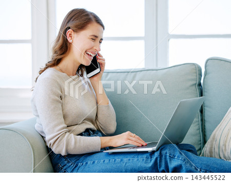 Woman, laptop and phone call for planning in home, freelancer and online for copywriter research. Female person, laughing and networking on couch, funny conversation and talk on website for project Woman, laptop and phone call for planning in home, freelancer and online for copywriter research. Female person, laughing and networking on couch, funny conversation and talk on website for project 143445522