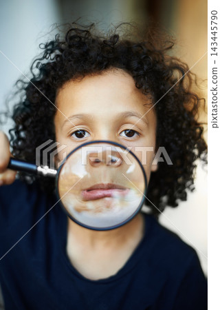 Boy, portrait and magnifying glass for funny face in home, explore and goofy kid for investigation. Male person, play and curious for child development, tool and lens for inspection or research Boy, portrait and magnifying glass for funny face in home, explore and goofy kid for investigation. Male person, play and curious for child development, tool and lens for inspection or research 143445790