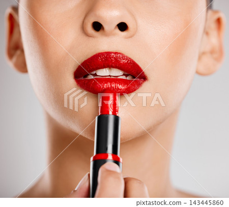 Woman, mouth and lipstick with application in studio for self care, cosmetics and beauty routine. Red, product and female person with makeup on face for shine, luxury and glamour on white background Woman, mouth and lipstick with application in studio for self care, cosmetics and beauty routine. Red, product and female person with makeup on face for shine, luxury and glamour on white background 143445860