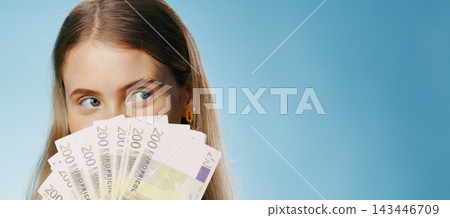 Money, thinking and woman cover face in studio with cash fan, finance or savings idea on banner mockup. Lottery, banking and person hide for budget secret, gambling or investment on blue background Money, thinking and woman cover face in studio with cash fan, finance or savings idea on banner mockup. Lottery, banking and person hide for budget secret, gambling or investment on blue background 143446709