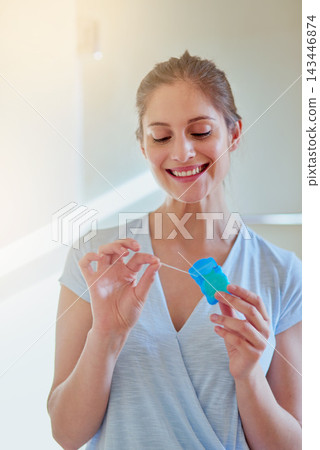 Woman, flossing and teeth with smile for dental or wellness, morning routine in bathroom for health. Person, cleaning and mouth for gum hygiene with oral tape, tooth with results for healthcare Woman, flossing and teeth with smile for dental or wellness, morning routine in bathroom for health. Person, cleaning and mouth for gum hygiene with oral tape, tooth with results for healthcare 143446874