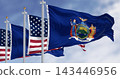 New York State flags waving with the American flag on a clear day 143446956