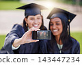 Graduation, women and friends with phone, selfie or smile together for university education. Photography, study and happy students with support, memory and achievement on screen at college campus 143447234