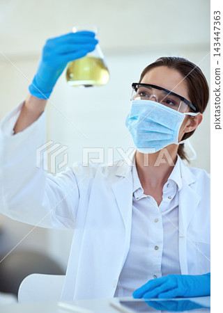 Woman, scientist and chemical in glass for scientific experiment, reaction and research. Healthcare, mask and test tube with medical study or innovation for vaccine, cure and sample for medicine 143447363
