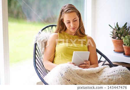 Tablet, woman and typing in a home with ebook app, blog and reading a social media post on break. Happy, living room and tech for online article in the morning on the internet and website for news Tablet, woman and typing in a home with ebook app, blog and reading a social media post on break. Happy, living room and tech for online article in the morning on the internet and website for news 143447476
