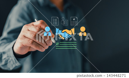 Businessman hand writing signature on virtual digital contract with handshake and business partnership icons. Concept of successful corporate deal, online agreement and b2b collaboration. 143448271
