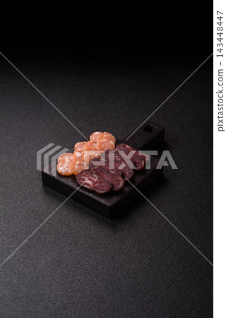 Sliced dry cured beef sausage or basturma with salt and spices. Sliced basturma Sliced dry cured beef sausage or basturma with salt and spices. Sliced basturma 143448447