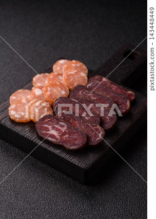 Sliced dry cured beef sausage or basturma with salt and spices. Sliced basturma Sliced dry cured beef sausage or basturma with salt and spices. Sliced basturma 143448449