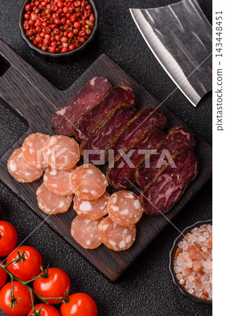 Sliced dry cured beef sausage or basturma with salt and spices. Sliced basturma Sliced dry cured beef sausage or basturma with salt and spices. Sliced basturma 143448451