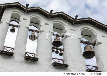 Bronze church bells in the belfry of Pskovo-Pechersky Dormition Monastery, Russia Bronze church bells in the belfry of Pskovo-Pechersky Dormition Monastery, Russia 143448843