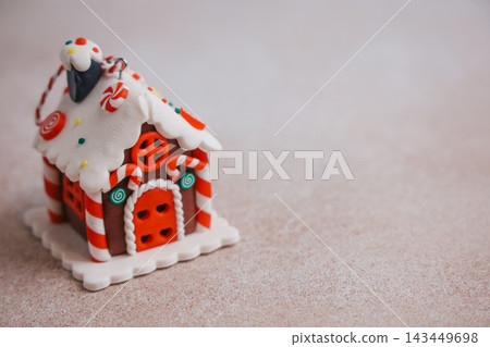 Sweet gingerbread house decoration set on a light surface for holiday cheer Sweet gingerbread house decoration set on a light surface for holiday cheer 143449698
