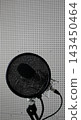 Special tripod for microphone and fabric shield screen for noise isolation and sound filtration for the announcer 143450464