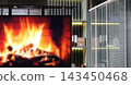 Props for decorating a TV studio with defocused burning bonfire on a TV monitor out of focus  143450468