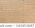 Panels made of wood with thin grooves fastened together with screws. 143451687