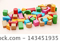 Horizontal Composition of Painted and Natural Wooden Toy Building Blocks on Pastel Pink Surface 143451935