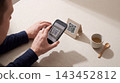 Customer scanning a qr code for mobile payment at a cafe table with technology transaction cashless business customer convenient commerce application software automated purchase ordering 143452812