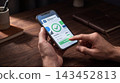 Person interacting with a mobile app for successful digital financial transaction technology verified business interface interaction transfer software internet commerce 143452813