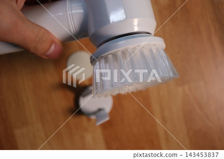 Hand Holding Cleaning Brush Close-Up Hand Holding Cleaning Brush Close-Up 143453837