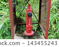 Red fire hydrants and fire prevention equipment in Yuzawa Town, Niigata Prefecture 143455243