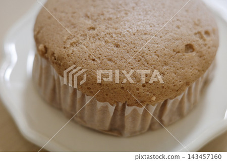 Close-up of the air bubbles and texture on the surface of a steamed bun. Close-up of the air bubbles and texture on the surface of a steamed bun. 143457160