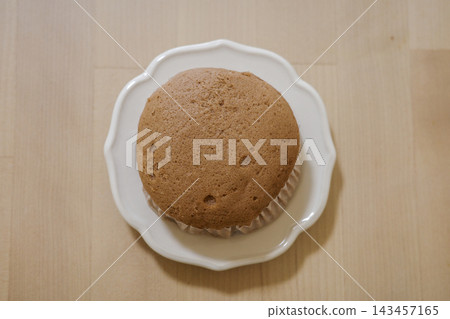 A small plate of chocolate-flavored brown steamed buns A small plate of chocolate-flavored brown steamed buns 143457165