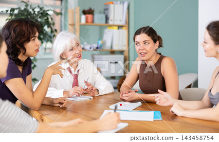 Female participate sit at circle, chatting, talking Female participate sit at circle, chatting, talking 143458754