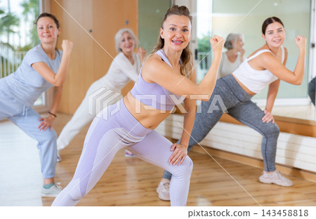 Dance class for people, positive women training in dance studio 143458818
