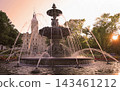 Quebec City Parliament illuminated in the evening by sun rays between trees with The Fontaine de Tourny on the foreground, Canada 143461212