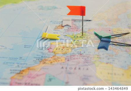 A map of Europe is shown with colorful pins indicating locations. France is marked clearly, and nearby countries are also visible. Various geographical features are outlined on the map. A map of Europe is shown with colorful pins indicating locations. France is marked clearly, and nearby countries are also visible. Various geographical features are outlined on the map. 143464849