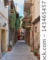 Narrow pedestrian alley with hanging plants in the La Ciambra neighborhood of Monreale, Sicily 143465457