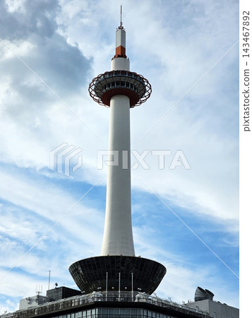 Kyoto Tower Landmark Against Blue Sky and Clouds in Kyoto, Japan. Kyoto Tower Landmark Against Blue Sky and Clouds in Kyoto, Japan. 143467892