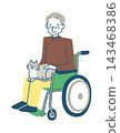 Animal therapy: A senior man in a wheelchair with a cat on his lap. 143468386