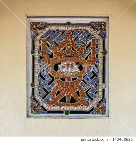 Intricate mosaic window on the external wall of Tam Dai Tu Temple at the Marble Mountains, Da Nang, Vietnam Intricate mosaic window on the external wall of Tam Dai Tu Temple at the Marble Mountains, Da Nang, Vietnam 143468626