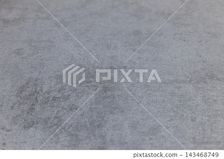 Gray stone surface background with subtle speckled pattern 143468749