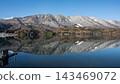 Autumn foliage and the Northern Alps reflected on the lake's surface: Lake Aoki, Nagano Prefecture 143469072