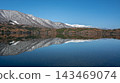 Autumn foliage and the Northern Alps reflected on the lake's surface: Lake Aoki, Nagano Prefecture 143469074