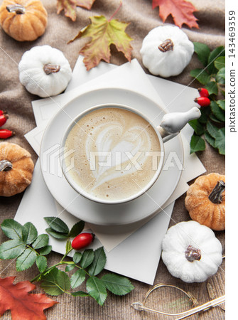 Autumn latte art heart with fall pumpkins and leaves Autumn latte art heart with fall pumpkins and leaves 143469359